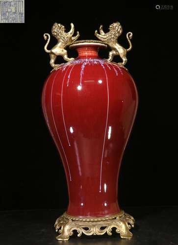 MONOCHROME RED GLAZED AND BRONZE ENCLOSED VASE WITH LION FIGURES