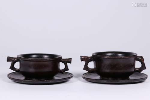 PAIR OF ZITAN WOOD CARVED CUPS WITH HANDLES AND SAUCER