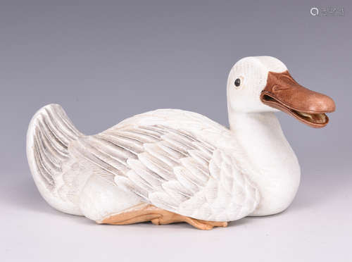 PORCELAIN AND GLAZED DUCK FIGURE