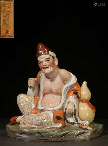 FAMILLE ROSE 'JI GONG' SEATED FIGURE