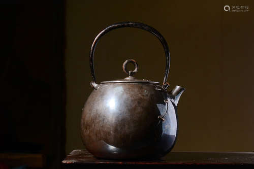 JAPANESE SHOWA PERIOD SILVER CAST TEAPOT WITH LIFTING HANDLE