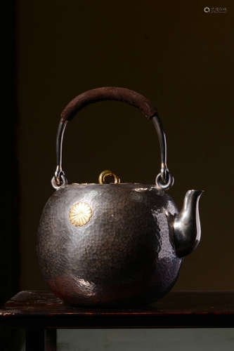 JAPANESE SHOWA PERIOD SILVER CAST AND CARVED TEAPOT WITH LIFTING HANDLE