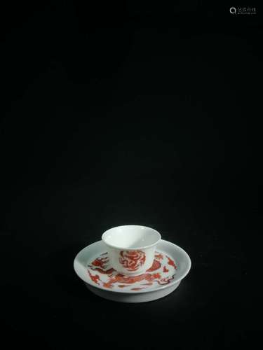 SET OF UNDERGLAZED RED 'DRAGON' TEA CUP AND SAUCER