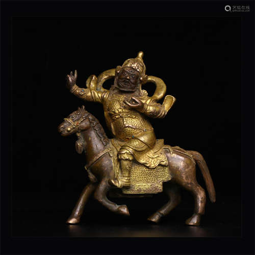 A Chinese Gilded Copper Fortune God Statue