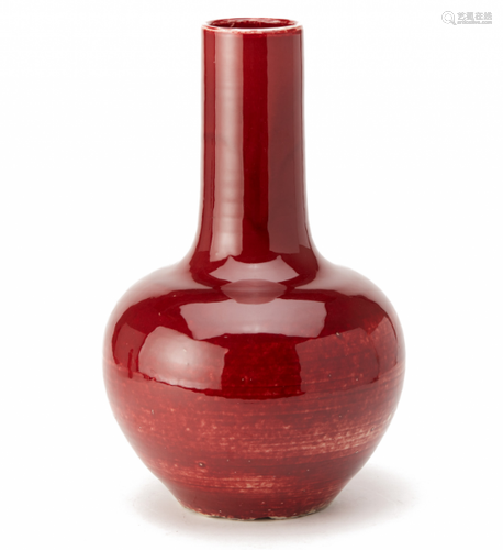 A LARGE RED GLAZED BOTTLE VASE