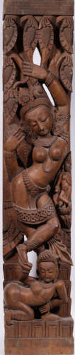 A WOOD CARVED FIGURE SHAPED STATUE