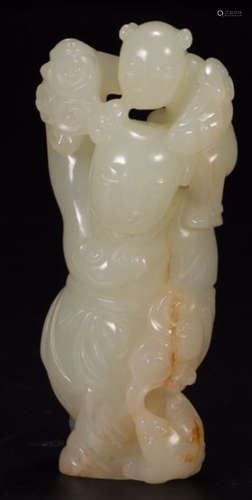 A HETIAN JADE CARVED CHILD SHAPE PENDANT