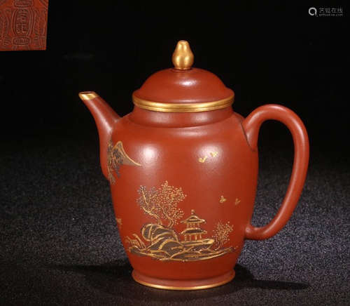 A MUD CARVED TEAPOT WITH LANDSCAPE PATTERN