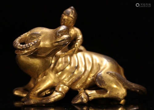 A GILT BRONZE CAST CHILD SHAPE PENDANT