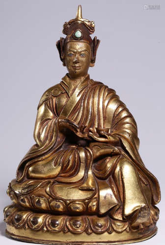 A GILT BRONZE CASTED PADMASAMBHAVA STATUE