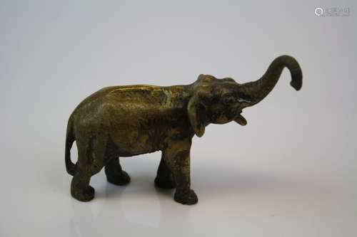 A brass/bronze figure of an elephant