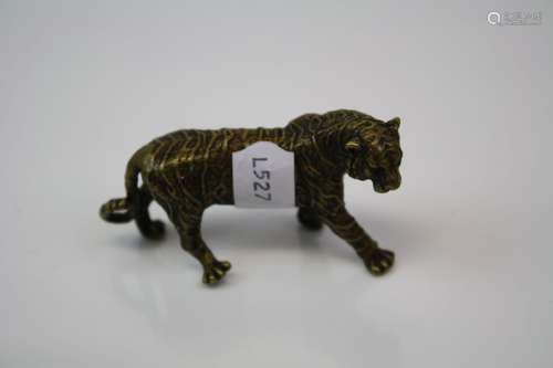 A brass/bronze figure of a tiger