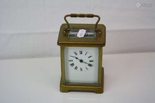 Antique French made brass cased carriage clock with white enamel dial complete with key.