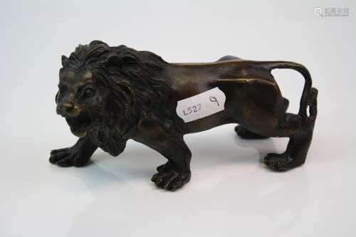 A brass/bronze figure of a lion