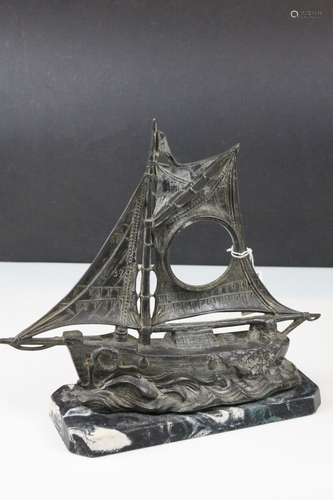 Art Deco Spelter Watch Holder in the form of a Sailing Boat on a Faux Marble Plinth, 26cms high