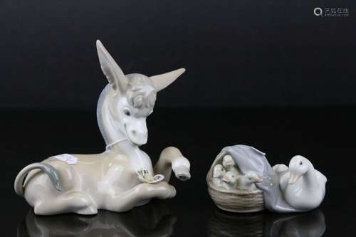 Two Lladro Figures - Donkey with Daisy, 17cms long and Duck with Ducklings in a Basket, 10cms long