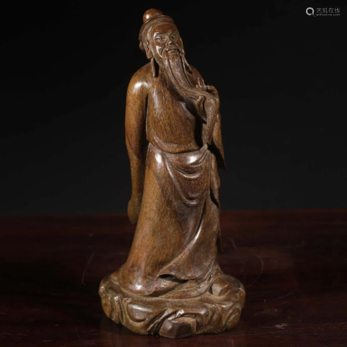 A CHINESE BAMBOO CARVED ST&ING FIGURE