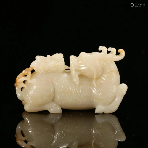 A CHINESE CARVED HETIAN JADE KYLIN ORNAME…