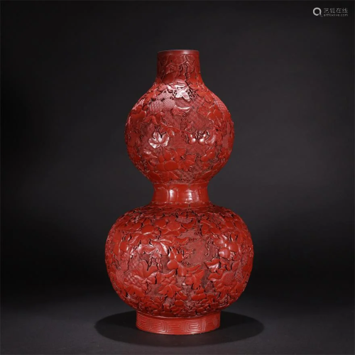 A CHINESE CARVED RED LACQUERWARE GOURD-SHAP…