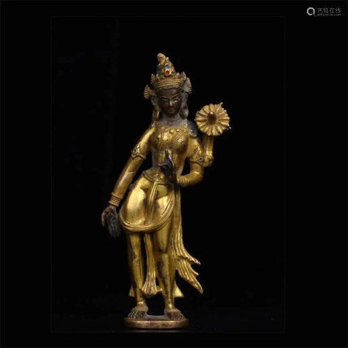 A CHINESE BRONZE GILDING ST&ING STATUE OF …