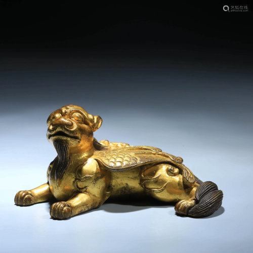 A CHINESE GILD COPPER BEAST ORNAMENT