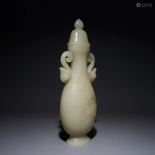 A CHINESE DOUBLE-EARED JADE VASE