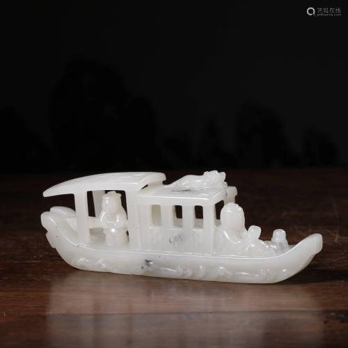 A CHINESE CARVED HETIAN JADE BOAT ORNAME…