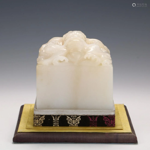 A CHINESE HETIAN JADE CARVED SEAL