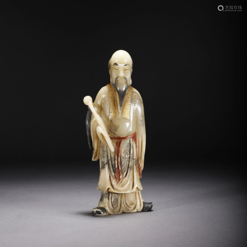 A CHINESE SHOUSHAN STONE CARVED TAOISM FIGU…