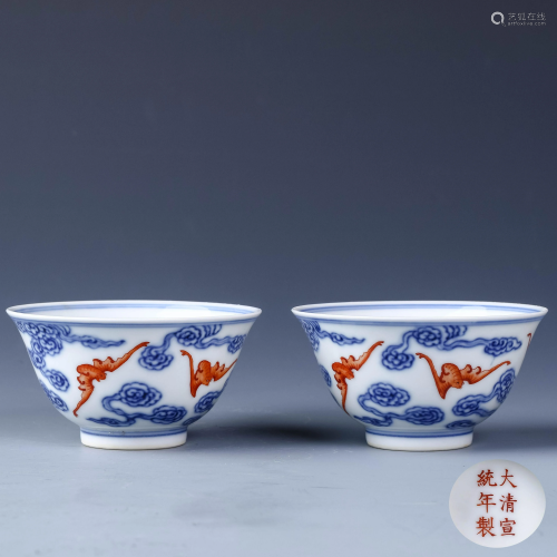 A PAIR OF CHINESE BLUE & WHITE IRON RED PAT…