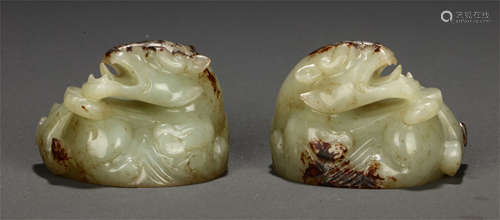 A PAIR OF CHINESE HETIAN JADE PAPER WEIGHT CARVED WITH RECUMBENT BEAST