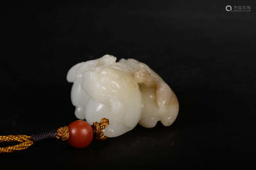 A Chinese Hetian Jade Carved Lion Ornament