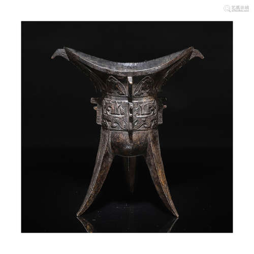 A Chinese Bronze Beast Pattern Libation Cup