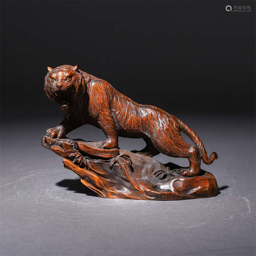 A Chinede Huanghuali Tiger Ornament