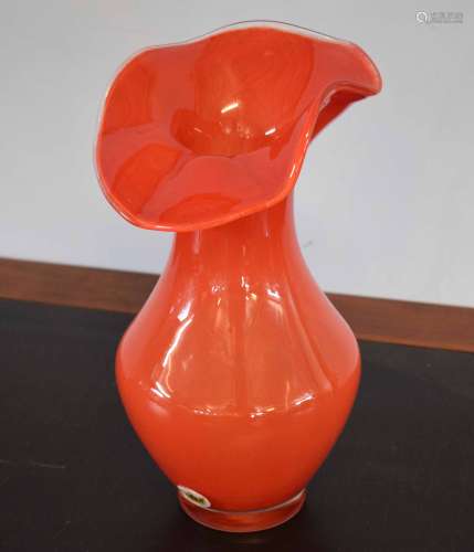 Swedish art glass vase in orange with flared top, maker's sticker to side