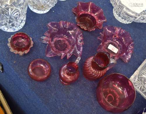 Group of cranberry glass wares including two small jugs and various bowls, (8)