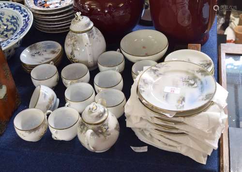 Early 20th century Japanese porcelain tea set, decorated with landscape scenes with herons and other