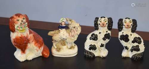 Group of three Staffordshire dogs and a further Staffordshire figure of a girl mounted on a goat