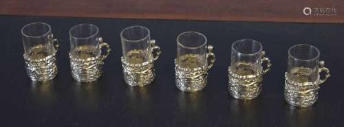 Collection of six small liquor or shot glasses in silver frames, the silver hallmarked for