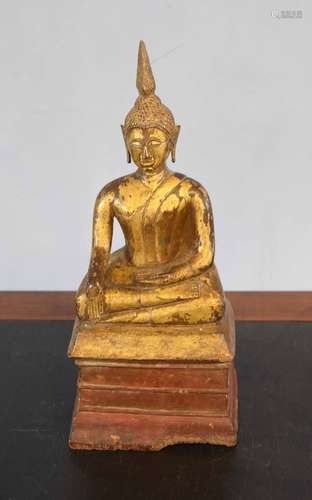 Wooden model of a Buddha, gilt painted on a wooden base