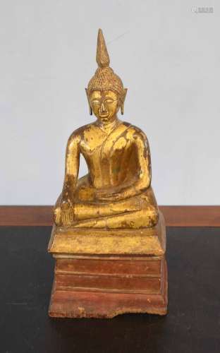 Wooden model of a Buddha, gilt painted on a wooden base