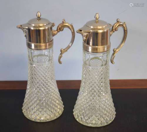 Pair of large claret jugs with silver metal mounts, 33cm high (2)