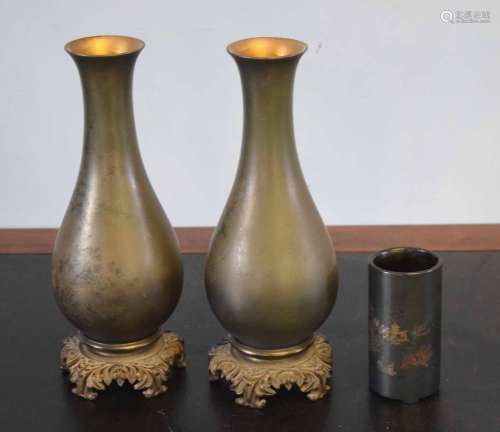 Two Japanese vases, decorated with figures in a landscape and a further vase with similar decoration