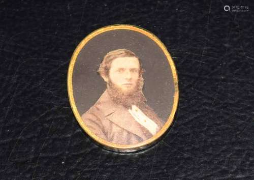 Vintage oval pendant inset with a print depicting a head and shoulders of a gentleman