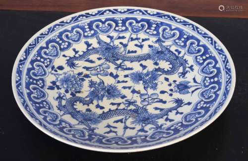 Oriental blue and white charger decorated with dragons