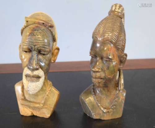 Two African carved heads of a man and a lady from the Mashona tribe, one signed R Mugari to base (