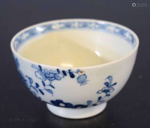 Lowestoft 18th century tea bowl with a blue and white floral and root pattern, the interior with