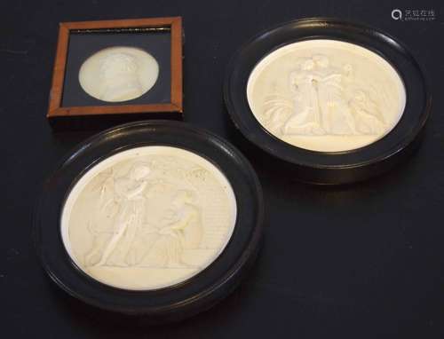 Collection of three plaster or composition framed circular plaques, two larger examples measuring