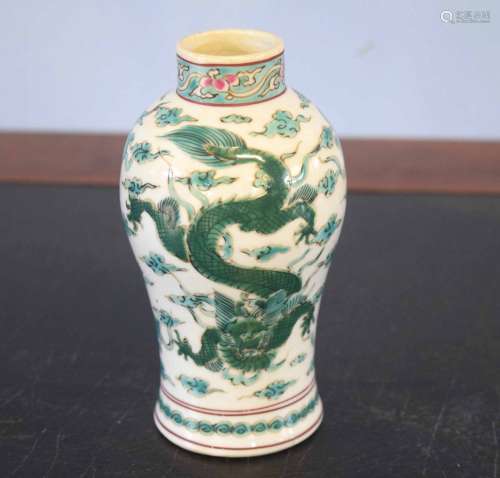 Oriental vase decorated in famille vert palette with a dragon chasing the flaming pearl
