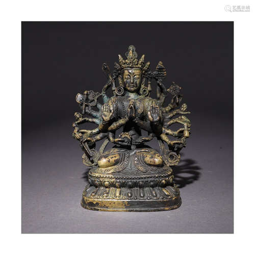 A Chinese Bronze Sitting Statue of Thousand-hand Guanyin